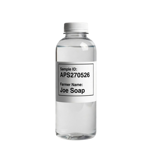 Clear bottle with a label on a black background